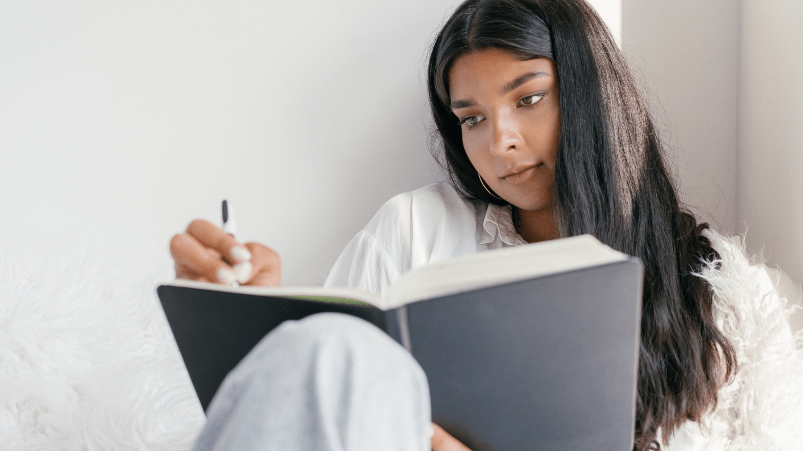 A woman writing in her diary about her life